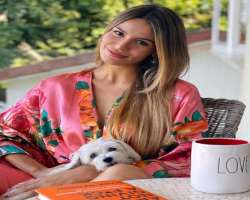 She is an animal lover and has a cute pet dog.